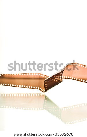 Film strip twisted reflection on white background