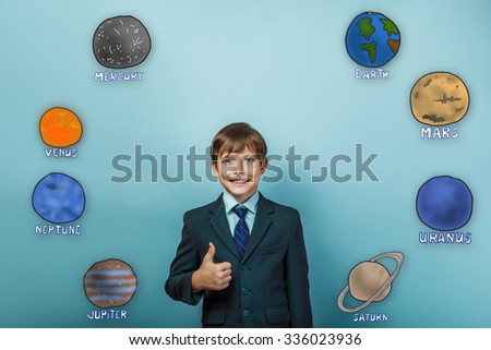 Teen boy businessman showing a sign and the smiles of the planet of the solar system astronomy