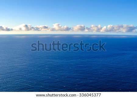 The geometry of the ocean. Reflection of clouds in water