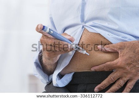 Insulin injection Royalty-Free Stock Photo #336112772