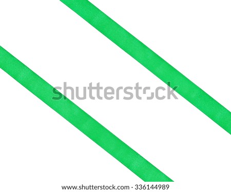 two diagonal parallel green silk ribbons isolated on white background
