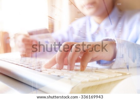  female using computer for online shopping holding credit card. double exposure effected photo.