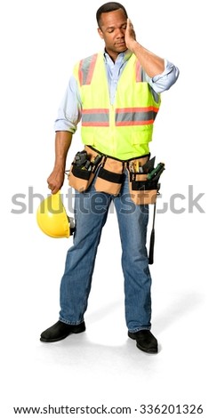 Tired Male Construction Worker with short black hair in uniform holding safety helmet - Isolated