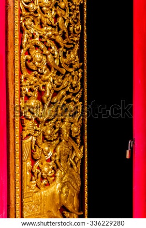 Thailand  art painting on the wall in red and gold background.