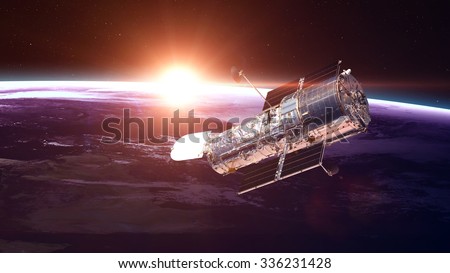 The Hubble Space Telescope in orbit above the Earth. Elements of this image furnished by NASA. Royalty-Free Stock Photo #336231428