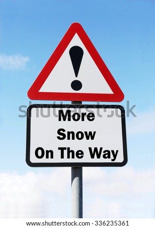 Red and white triangular road sign with a More Snow On The Way concept against a partly cloudy sky background