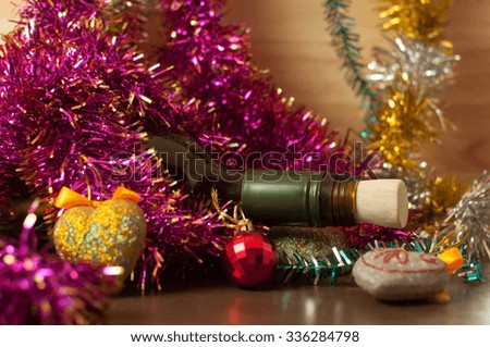 Wine And Decorations on table - christmas or winter warming drink. background bokeh turnovers vintage