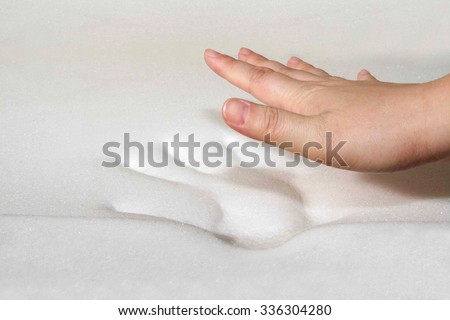 Hand stamp on memory foam Royalty-Free Stock Photo #336304280