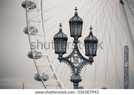 Vintage lamp post on Westminster Bridge in London in black and white.