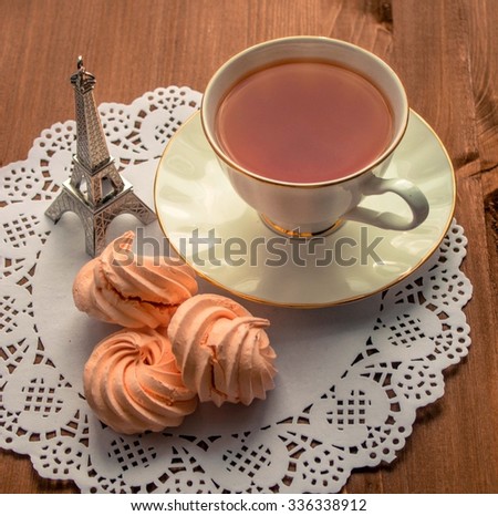 Meringue with cup of tea. Vintage