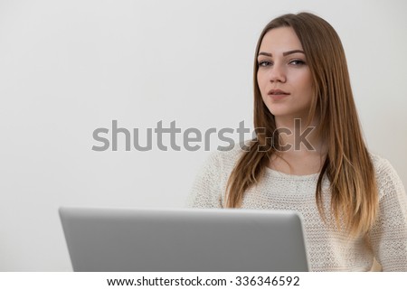 Girl with notebook on grey background