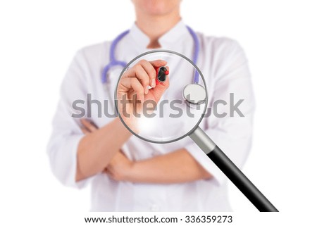 The doctor is holding the red marker, ready to write, isolated background, magnifying glass