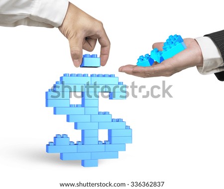 One hand holding blue stack blocks to the other hand completing dollar sign shape, isolated on white background.