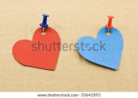 Heart tags attachment of pushpins in cardboard