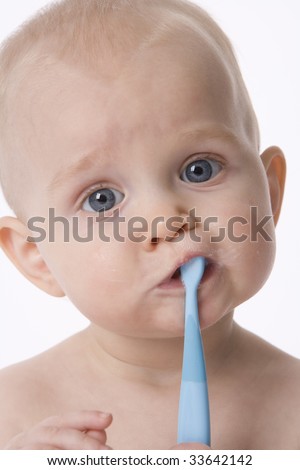 Baby boy pretending brushing his teeth