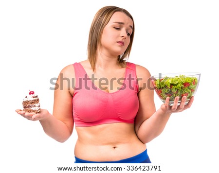 The concept of healthy eating. Fat woman dieting isolated on a white background