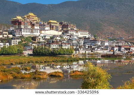 Songzanlin Temple also known as the Ganden Sumtseling Monastery, is a Tibetan Buddhist monastery   in Zhongdian city( Shangri-La), Yunnan province  China  and is closely Potala Palace in Lhasa  Royalty-Free Stock Photo #336425096