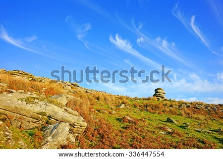 Panorama view of the Cheesewring bathed in late afternoon winter sunshine, this granite tor is a natural weathered formation and is about 7 metres high, Bodmin Moor, Cornwall, England, UK