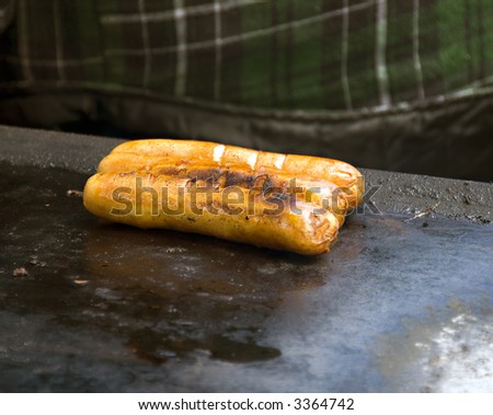 Hot dogs at an open grill in a local fair