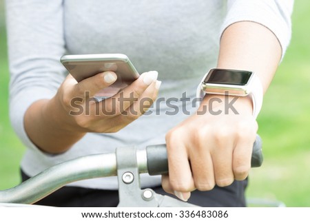 Women using application on mobile phone and hand watch technology