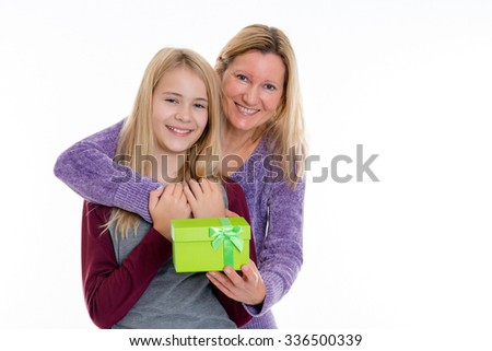 blond girl and woman with a green gift box