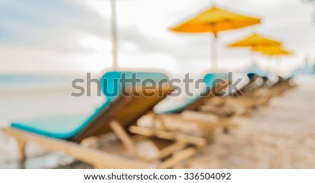 image of blurred  sunbed at beach with bokeh for background usage.