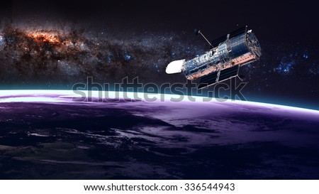 The Hubble Space Telescope in orbit above the Earth. Elements of this image furnished by NASA. Royalty-Free Stock Photo #336544943