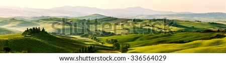 Beautiful and miraculous colors of green spring panorama landscape of Tuscany, Italy. Royalty-Free Stock Photo #336564029