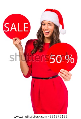 Portrait of a young beautiful woman with a Christmas hat on his head. Christmas Sale. Isolated on white background