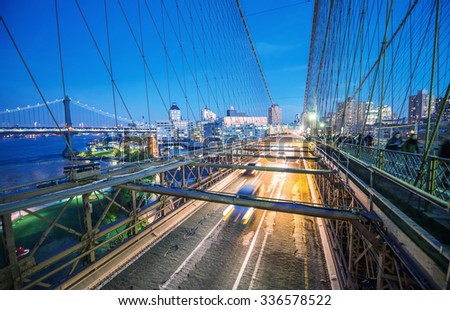 Traffic at night along Brooklyn Bridge, New York City.