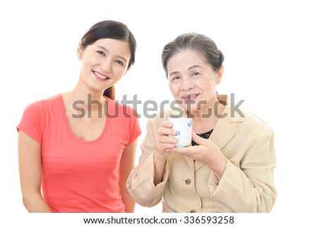Smiling old woman and young lady