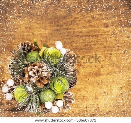Christmas decorative composition on wooden table background.