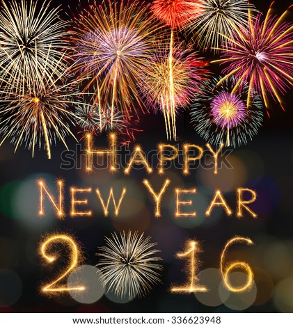 Happy new year 2016 written with Sparkle firework on black background with fireworks