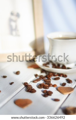 Morning coffee on a white background coffee beans scattered, love and good memories.