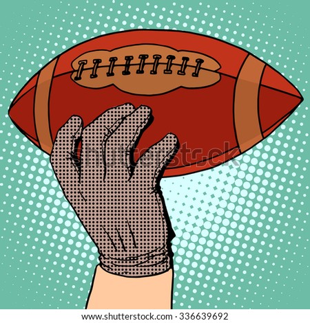 The ball of American football in his hand pop art retro style. Sports and Hobbies
