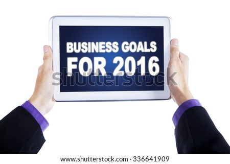 Image of businessman hands holding a digital tablet with business goals on the screen, isolated on white background