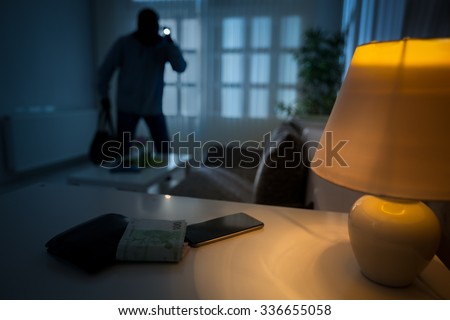 
intrusion of a burglar in a house inhabited Royalty-Free Stock Photo #336655058