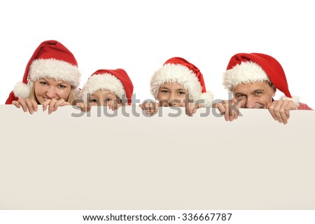 family with kids   in santa hats with white blank