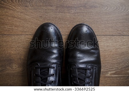 Brown leather shoes on the wooden floor 