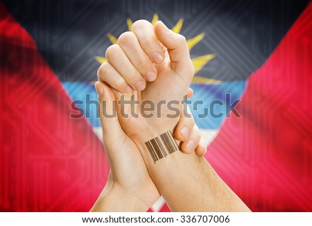 Barcode ID number on wrist of a human and national flag on background - Antigua and Barbuda