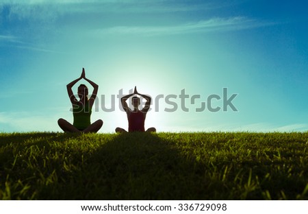 Couple doing yoga.