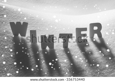 White Letters Building English Text Winter On White Snow. Snowy Landscape Or Scenery With Snowflakes. Christmas Card For Seasons Greetings Or Usable As Background.