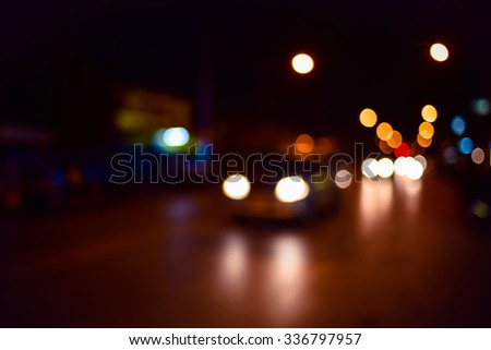 Out of focus lights of a street at night