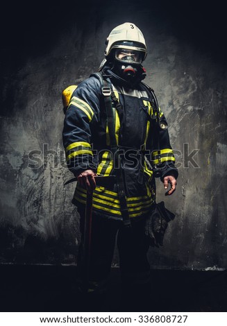 Rescue man in firefighter uniform and oxygen mask.