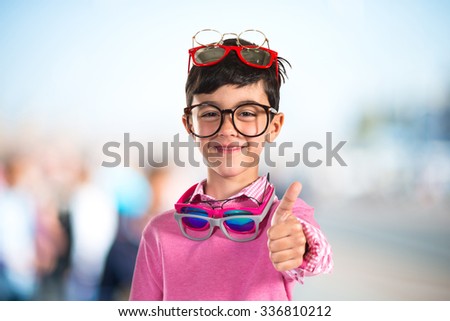 Happy boy with many glasses