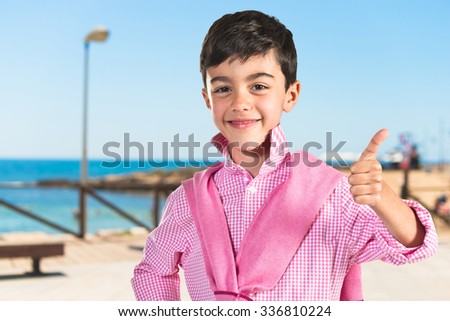 Boy with thumb up 