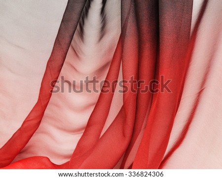 Abstract black-red soft chiffon texture background. Macro with extremely shallow dof.