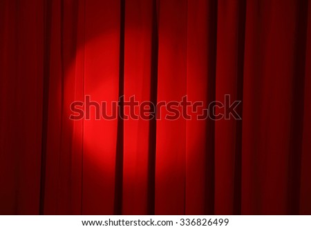 spot light on the red curtain of stage