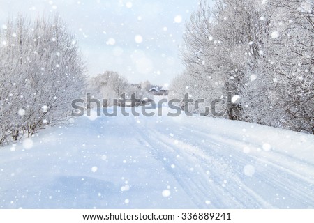 Snowy road through the forest, day. Royalty-Free Stock Photo #336889241