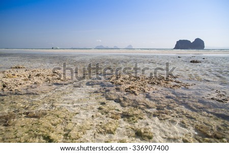 Beautiful, sea, beach, rock, sand, sky and island. Summer traveling in Thailand.